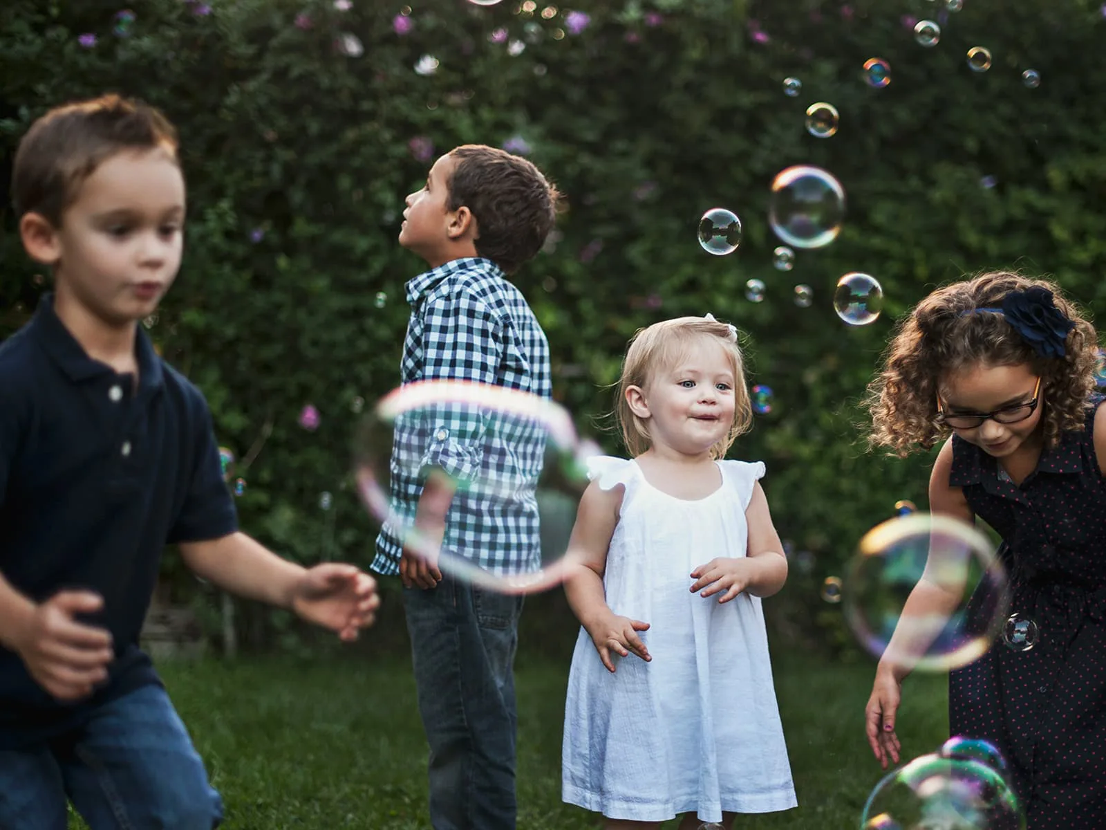 Kids playing with bubbles